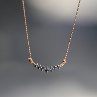 Curved Sapphire 14k Gold Nylon Cord Necklace Image